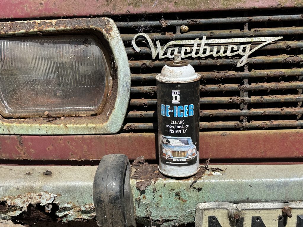 Vintage Big D de-icer aerosol can on classic Wartburg grille barn find