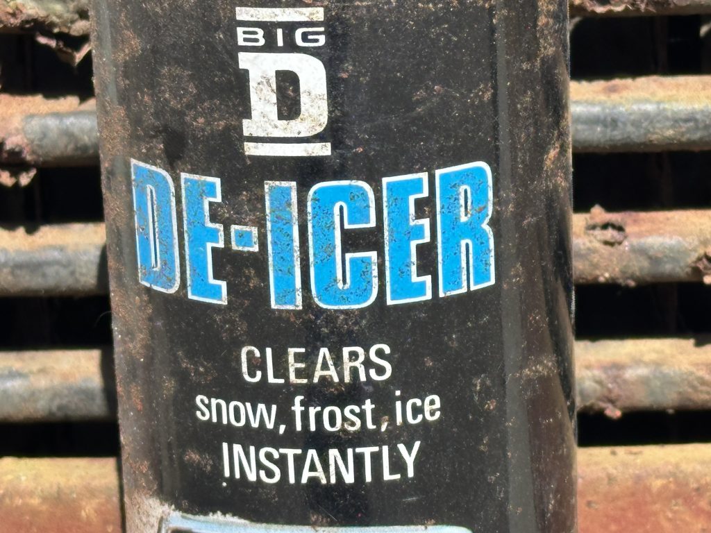 Close-up of Big D de-icer label clearing snow frost ice instantly vintage aerosol