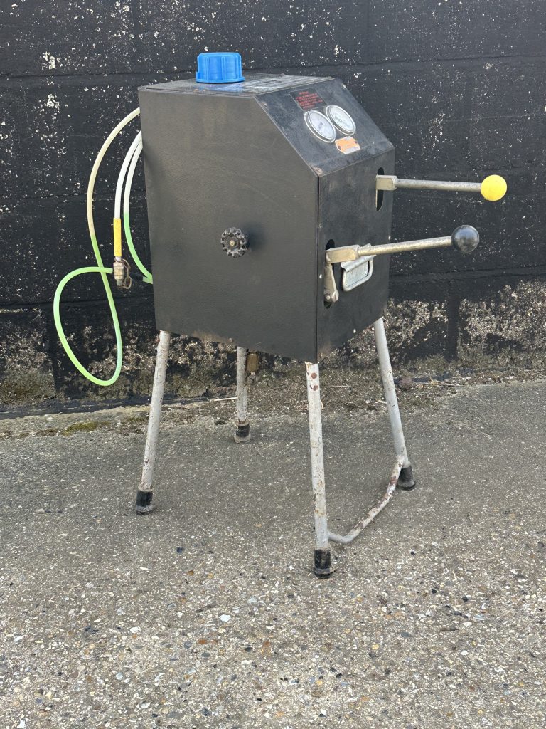 Side view Churchill Hydrolastic pump with hoses and valves