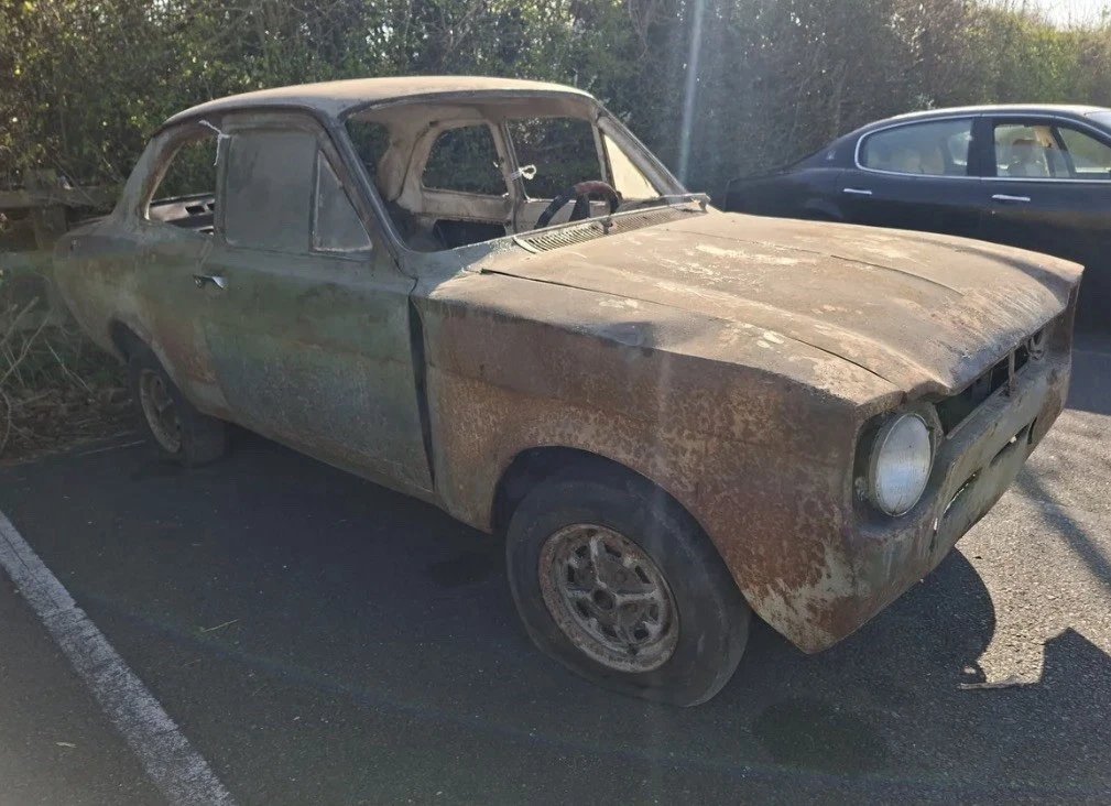 Ford Escort Mk1 project car side view rusted body shell
