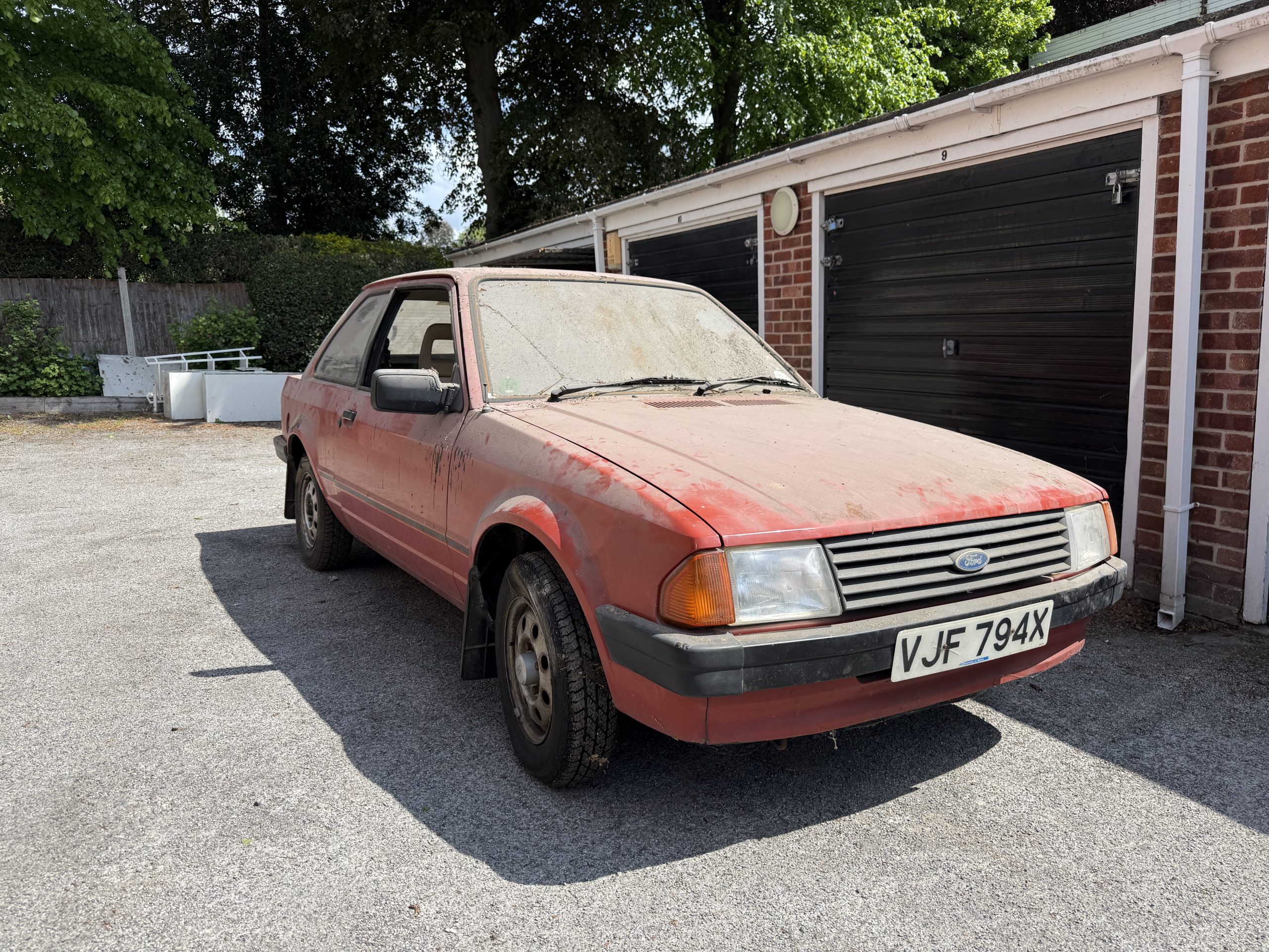 Front view of dusty 1982 Ford Escort Mk3 survivor