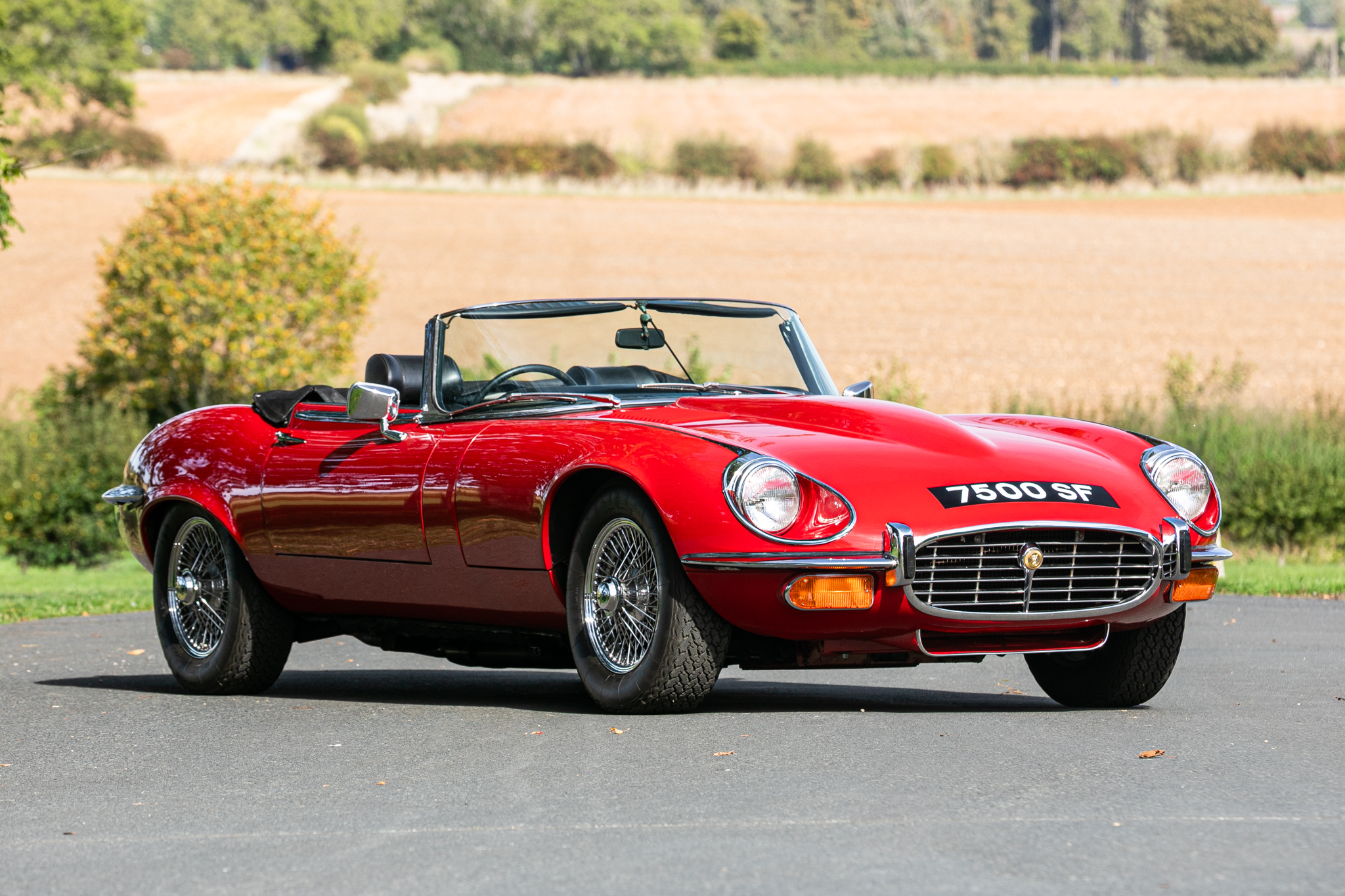 Nick Mason's red 1973 Jaguar E-type Series 3 V12 Roadster, photographed with its roof down
